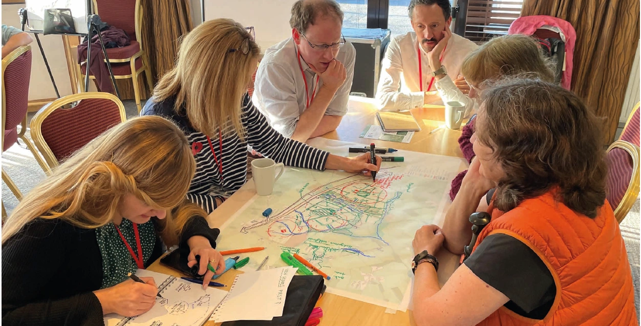 Community Engagement Day Looking at Plans Group of People