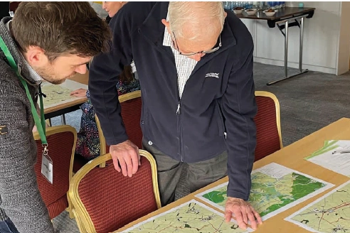 Community Engagement Day Looking at Plans